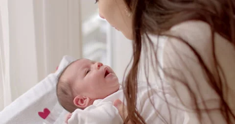 Mother with newborn. Child develops secure attachment or relationship to parent. 스톡 동영상 237253367