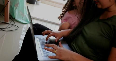 Mother parenting and working at the same time, mom multi-tasking between work 写真素材