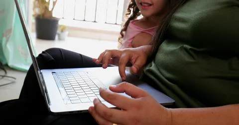 Mother parenting and working at the same time, mom multi-tasking between work Stock Photos