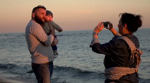 Mother photographing the father of the child, super slow motion Stock Footage 60064053