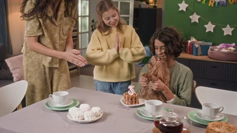 Mother Placing Dog Cake on Table and Clapping Hands with Two Children Stock Footage 330121440