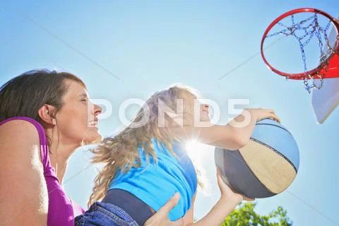 Mother Play Basketball With His Daughter