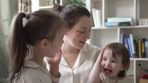 Mother Playing And Hugging With Two Little Daughters Stock Footage 240309939