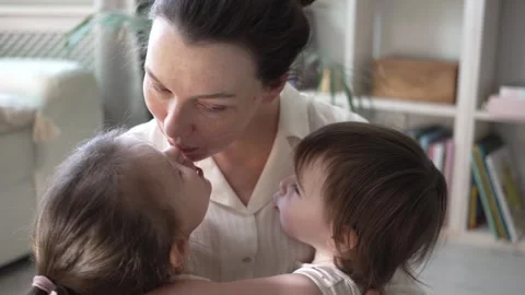 Mother Playing And Hugging With Two Little Daughters Stock Footage 240309972