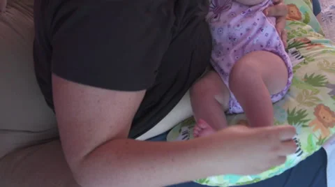 Mother Playing with Baby's Toes While Breastfeeding Video stock 40195028