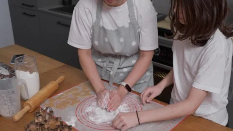 Mother preparing leftover cookie dough for a second batch of baking. Stock Footage 311807107