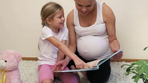 Mother reading to child Stock Footage 82059824