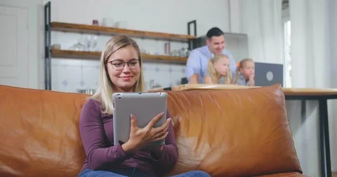 Mother relaxing on couch Stock Footage 116336288