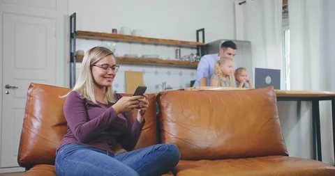 Mother resting while father looking after kids Stock Footage 116335536