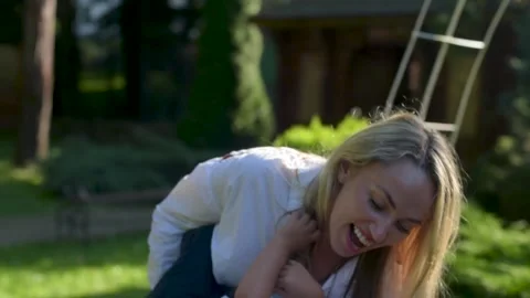 A mother is running and jumping with boy on her back. Stock Footage 161411348