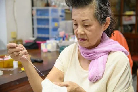 Mother is sewing Foto stock
