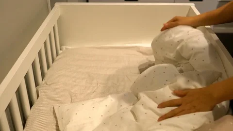 The mother sheets on the bed of children Stock Footage 79431926