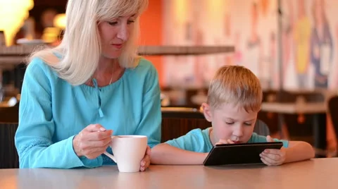Mother with son in cafe Video stock 64149051