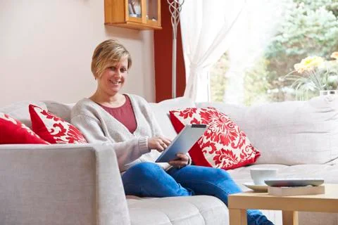 Mother on tablet computer Stock Photos