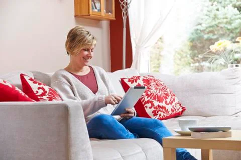 Mother on tablet computer Stock Photos