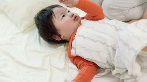 A Mother Taking Her Son's Temperature Stock Footage 327596256