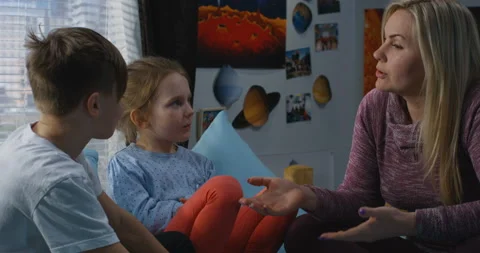 Mother talking with bickering siblings Stock Footage 105881090