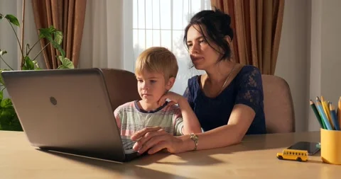 Mother Teach Child Study Online Using Laptop Computer. Boy Distance Learning 4K Stock Footage 160829699