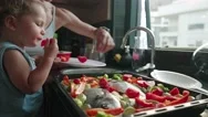 Mother Teaches Her Little Son How To Cook Healthy Food In The Kitchen. Lifestyle Stock Footage