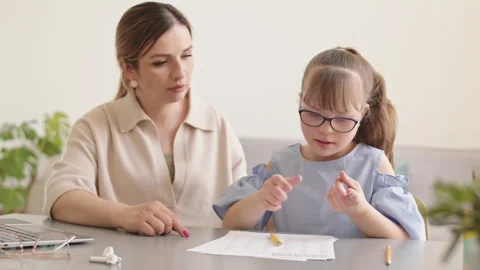 Mother Teaching Math to Daughter with Down Syndrome Stock Footage 309411481
