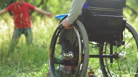 Mother throwing freesbee to her son spending time in a park. Stock Footage 130052832