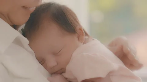 Mother touching back baby Stock Footage 276844371