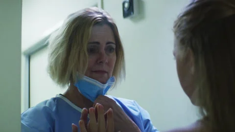 A mother Trying to Touch the Hand of Her Daughter over Glass Stock Footage 264095988