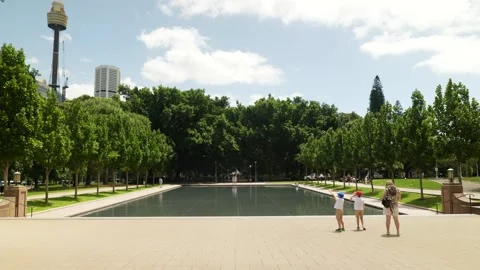 Mother with two boys visit the Pool of Reflection in Sydney 6K Stock Footage 299881966