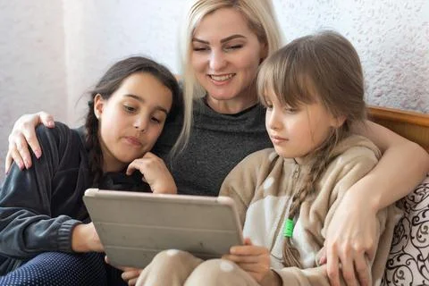Mother with two children using Tablet PC Foto stock