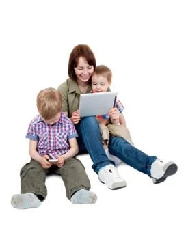 Mother with two sons and tablet computer Stock Photos