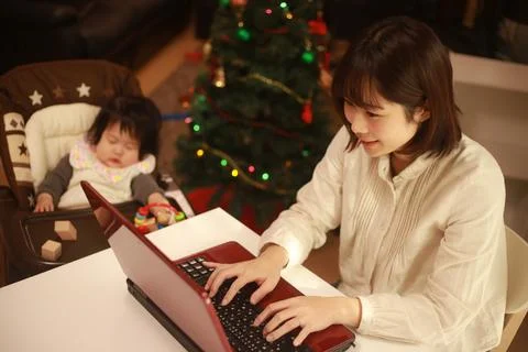 Mother using computer Stock Photos