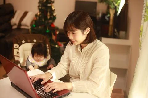 Mother using computer Stock Photos