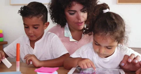 Mother using tablet with children at home 库存影片 141051210