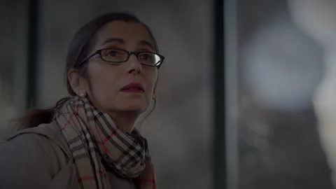 Mother Waiting for Son at Train Station Checking the Time to Consult a Stock Footage 266631455