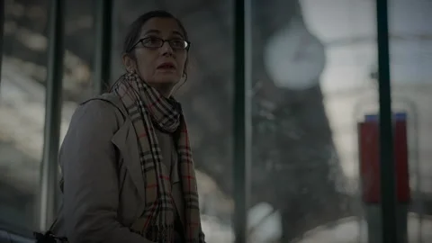 Mother Waiting for Son at Train Station Checking the Time to Consult a Stock Footage 270974890