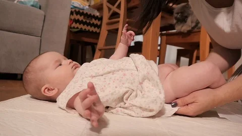 Mother washes an Ass of little Baby Child and Change the Diaper Stock Footage