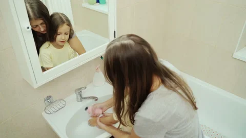 Mother Washes Small Child's Hands With Soap Stock Footage 143684589
