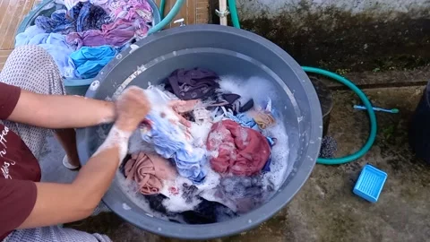 A mother is washing clothes 스톡 동영상 158653549