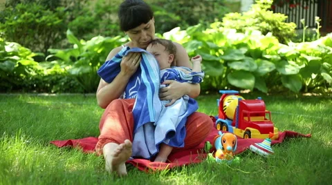 Mother wipe child  Stock Footage 64947968