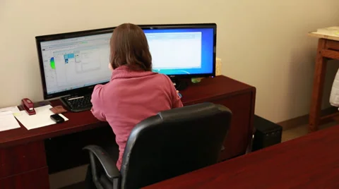 Mother at work with her toddler Stock Footage 32862386
