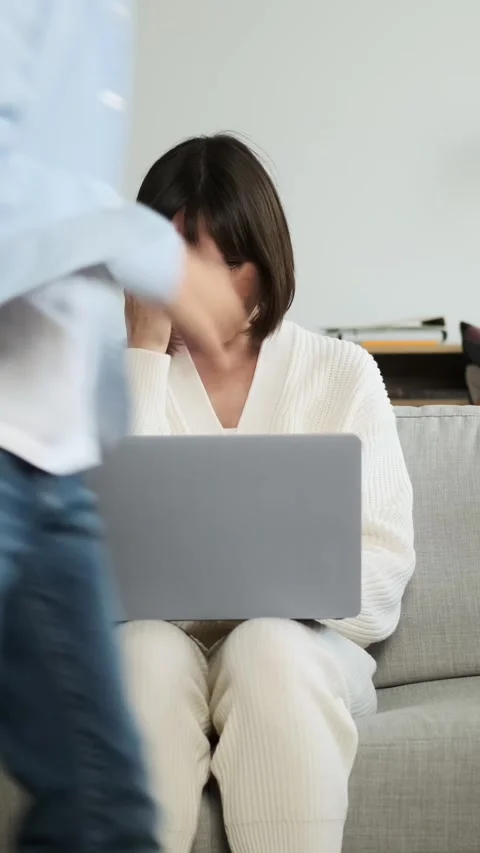 Mother Working Using Laptop While Children Running Around At Home Stock Footage 282342423