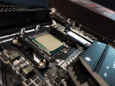 Motherboard and processor in socket of a gaming computer Stock Photos