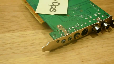 Motherboard and sticker devops rotate on wooden background, Stock Footage 155804666
