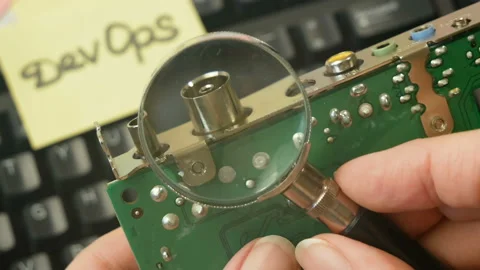 Motherboard and sticker devops rotate on wooden background, devops Stock Footage 160811087