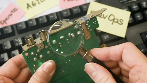 Motherboard and sticker devops rotate on wooden background, devops Stock Footage 160811168
