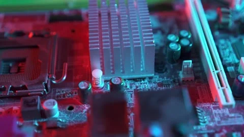 Motherboard close up, microchip, pc red-blue lighting Stock Footage 142375644