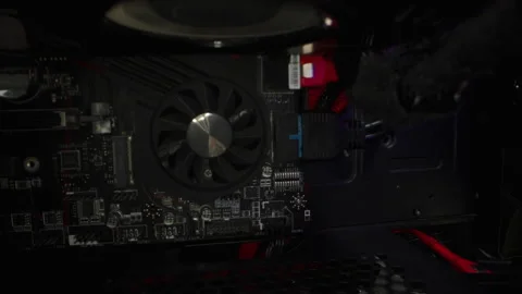 Motherboard inside a working computer system unit with RGB lit coolers. Slider, Stock Footage 266185110