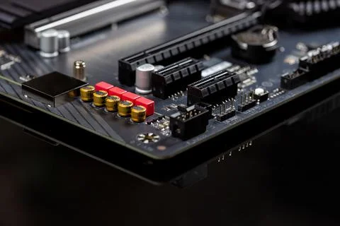 Motherboard on a table close-up, inside of a desktop computer, selective focu Stock Photos