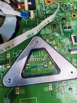Motherboard with triangular metal mounting bracket. Stock Photos