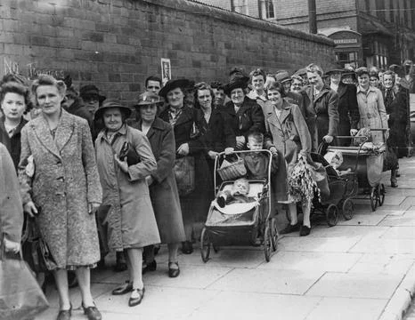 Mothers With Babies In Prams Having To Queue For Their Shopping In Birmingham. Stock Photos